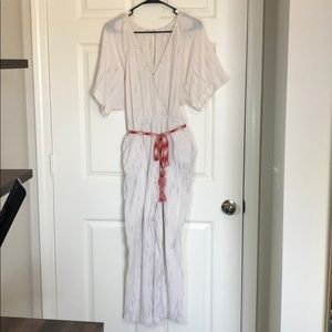 Anthropologie Cream romper with belt.